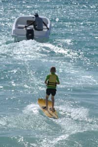 Child water skiing at Constance Belle Mare Plage