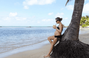 Laura Fantacci drinking some coconut water during her stylish babymoon