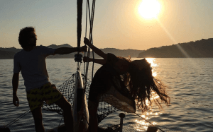 Alessandra Grillo on a boat at sunset
