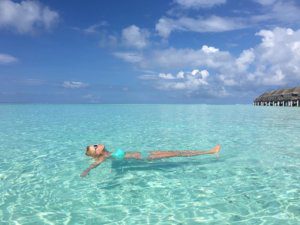 Floating in crystal clear Maldivian seas