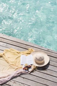 Reading by crystal clear waters