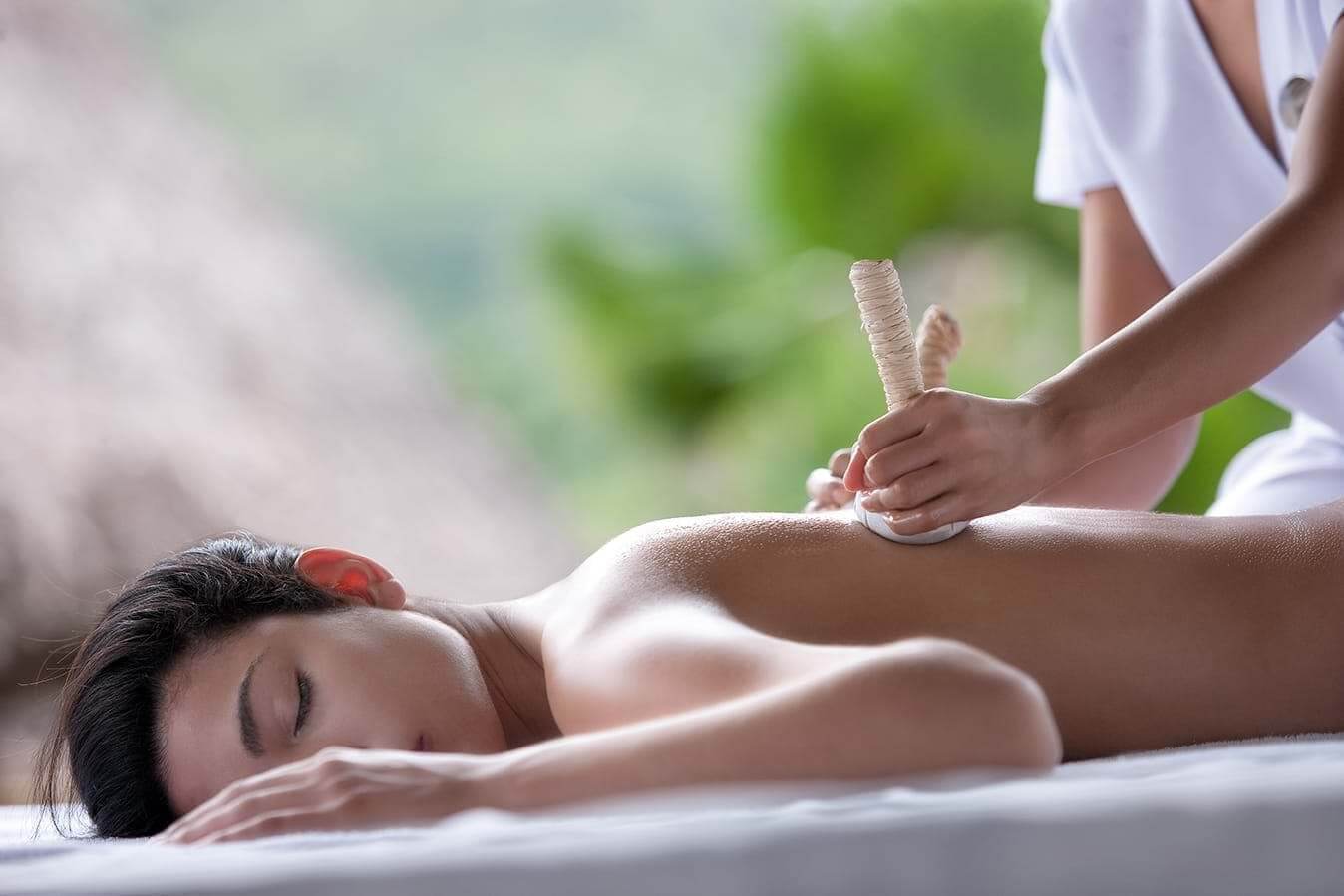Massage using coconut pouches